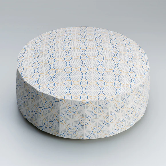 Box with wavy stripes and check design in cut paper stencil.
