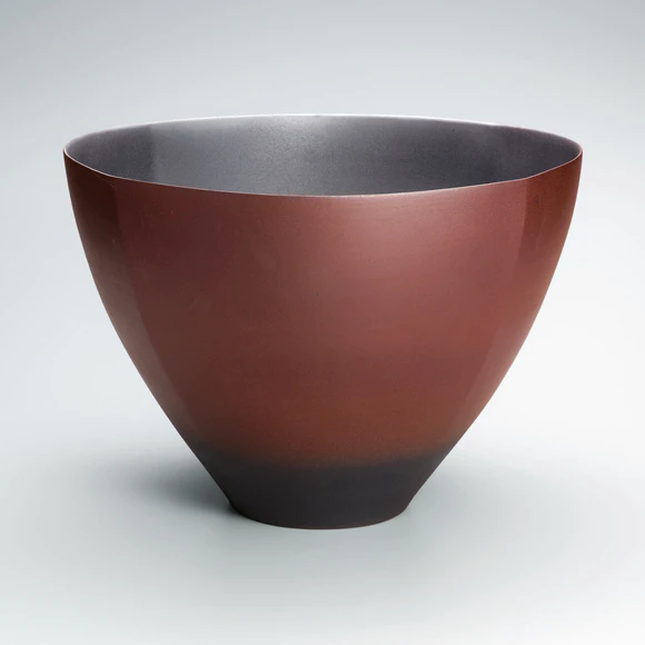 Flower vessel with red glaze.