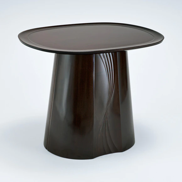 Pedestaled table of walnut wood with gale design finished in wiped urushi.