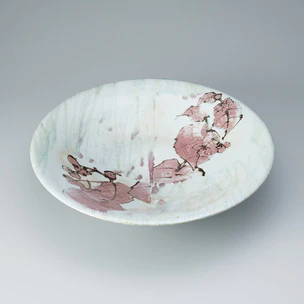 Bowl with begonia design in underglaze iron and copper.