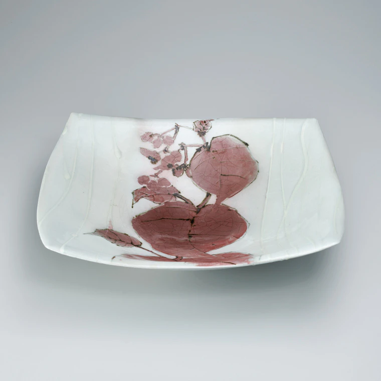 photo Bowl with begonia design in underglaze iron and copper