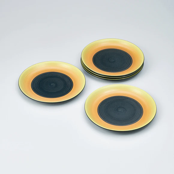 Set of plates with yellow glaze, engraved line and chattered pattern design