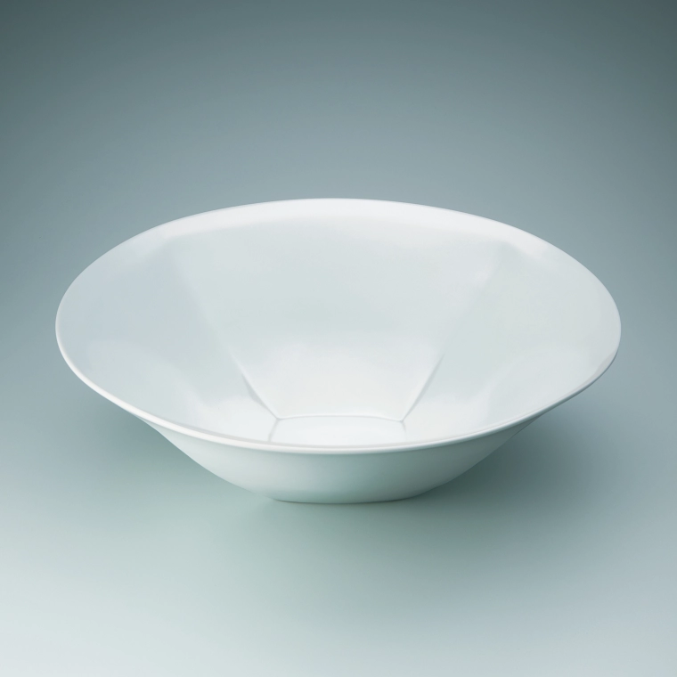photo White porcelain faceted bowl.