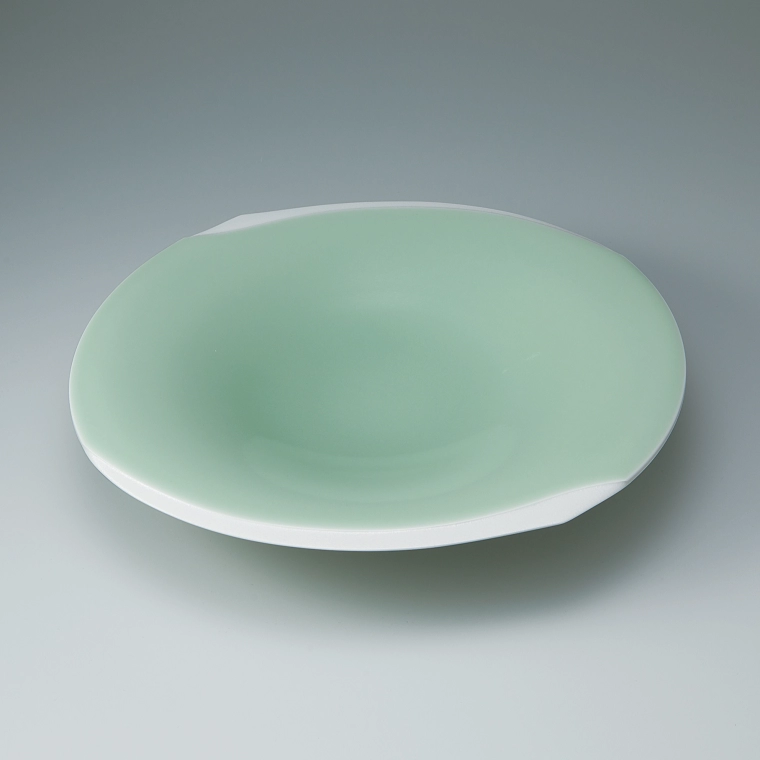 photo Bowl with pale green celadon glaze.