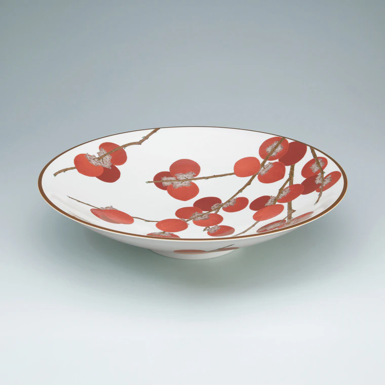 photo Bowl with persimmon design on milky white background.