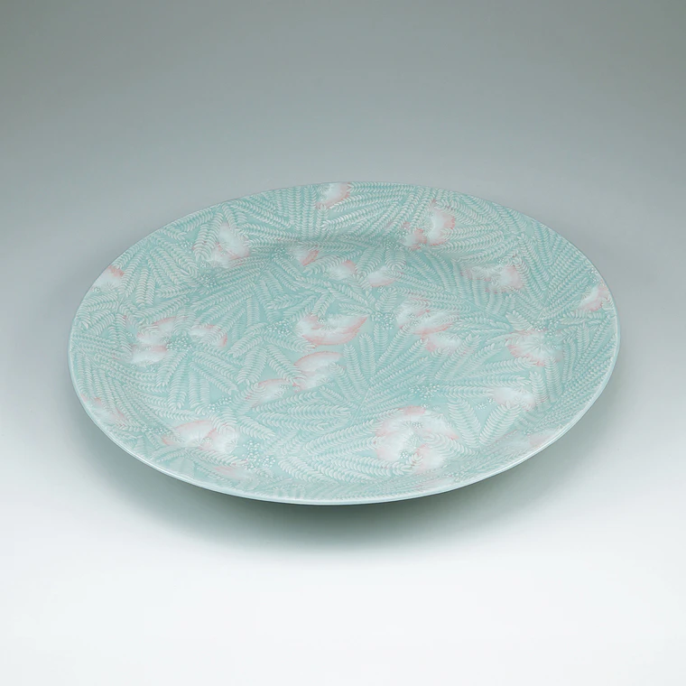 photo Large dish with celadon glaze and pink silk tree design.