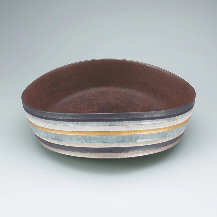 photo Large bowl with ash glaze and engrave line design.