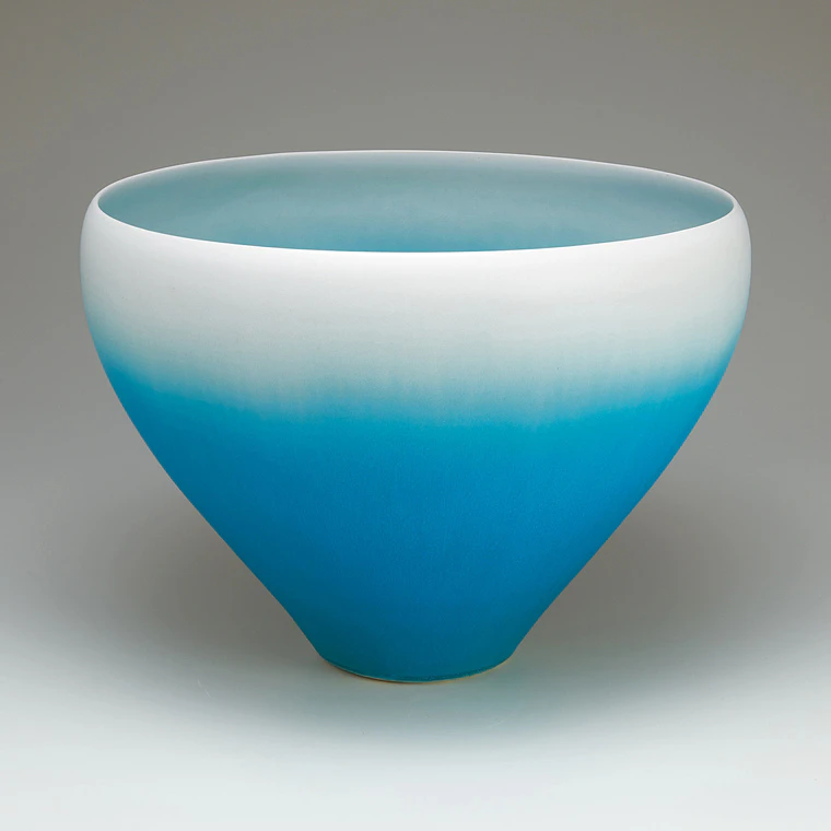 photo Flower vessel with blue glaze.