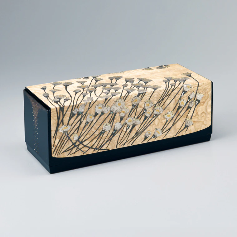 photo Box with design in makie on plain wood surface. “Bright and clear autumn day”