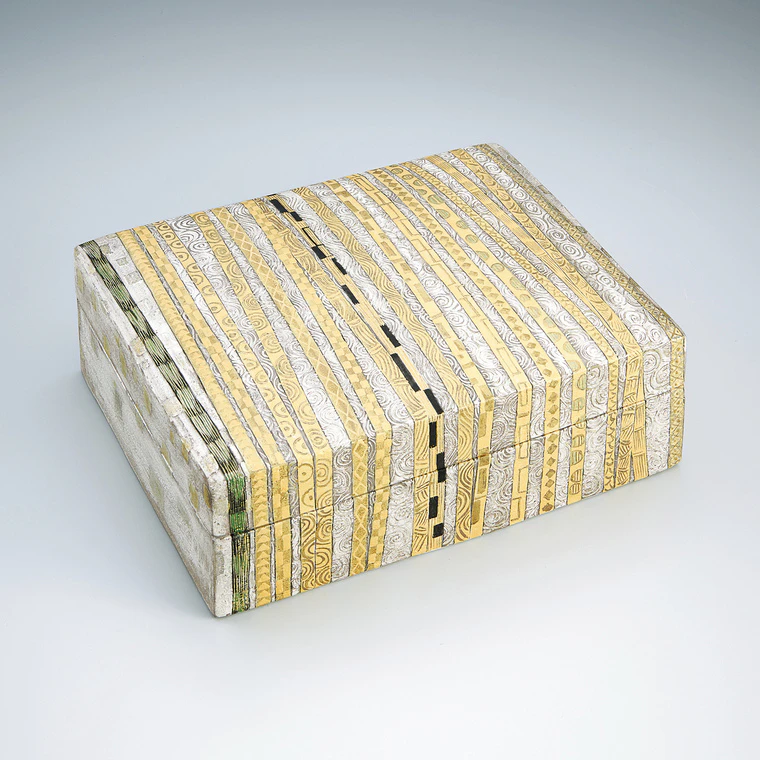 photo Square box with gold and silver decoration.