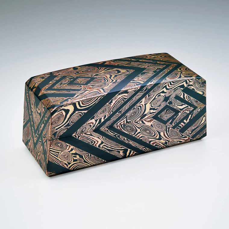 photo Coffer of gold, silver and copper mokumegane with woven fence design in cutout inlay.