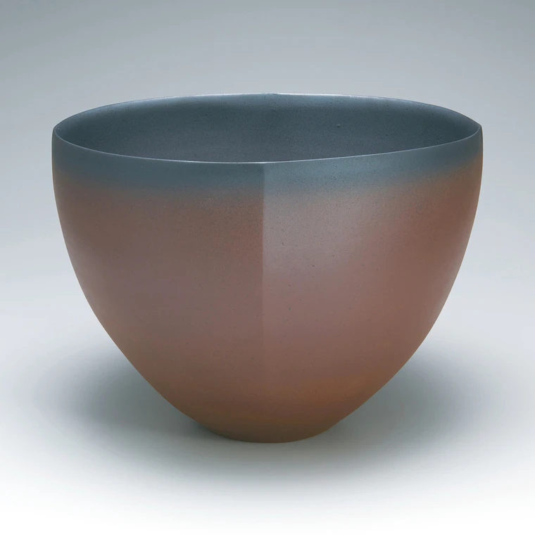 photo Flower vessel with red glaze.