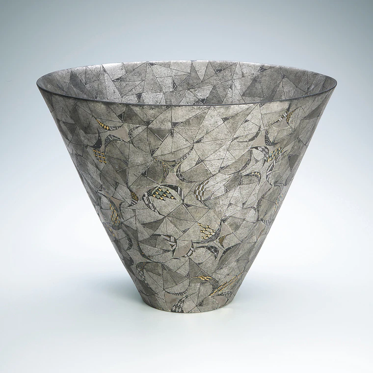 photo Flower vessel with geometric design in platinum painting.