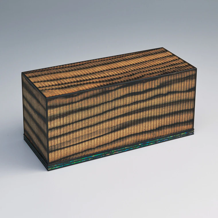 photo Coffer of black-streaked persimmon wood finished in wiped urushi.