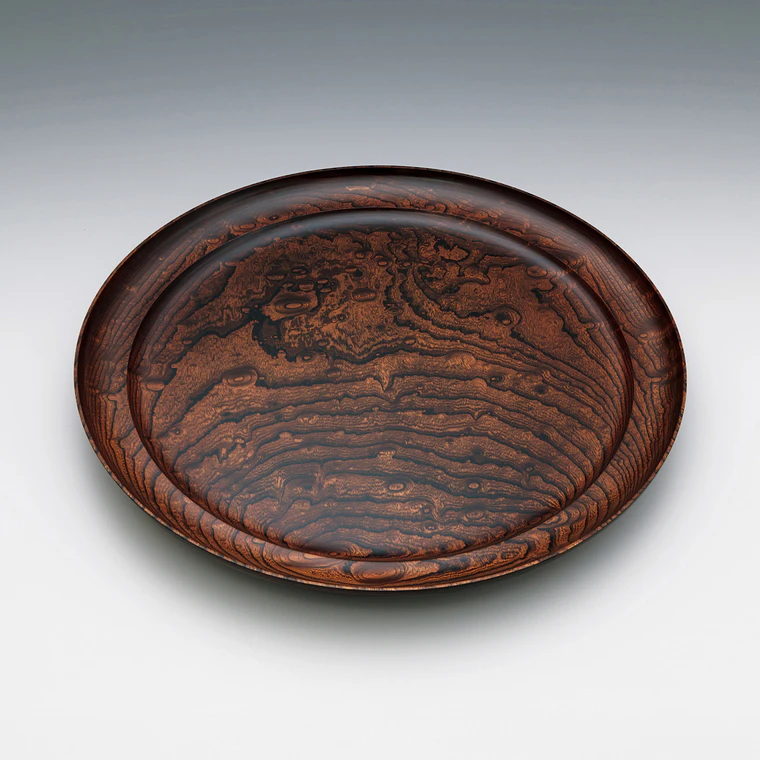 photo Dish of zelkova wood finished in wiped urushi.
