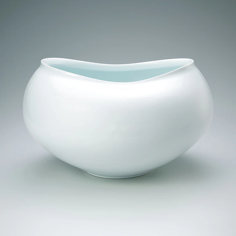 photo White porcelain irregularly shaped jar with white glaze in kakewake style.