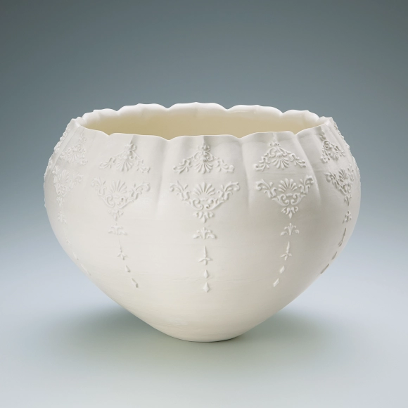 Jar with raised white slip design.