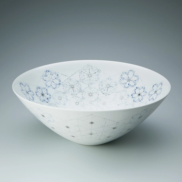 White porcelain bowl with design in glaze painting.