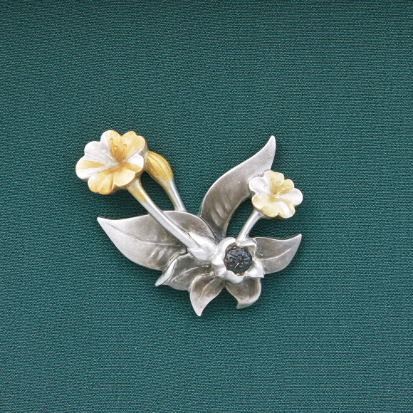 Brooch in shape of four o’clock flower.