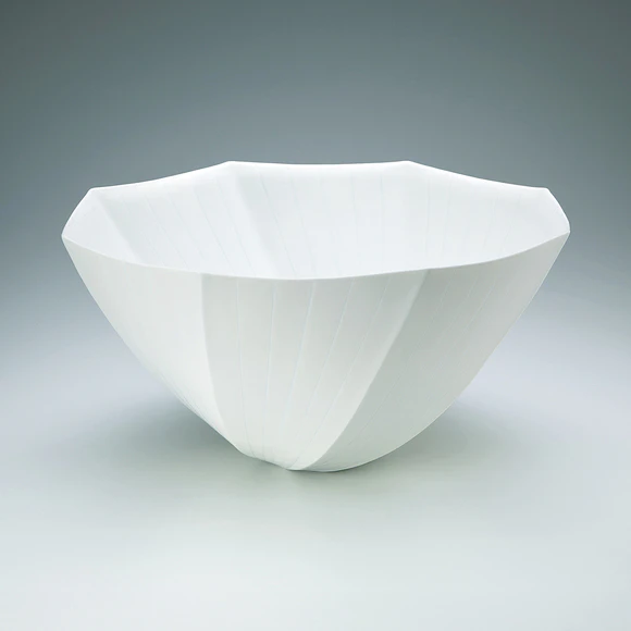 Flower vessel with glaze inlay.