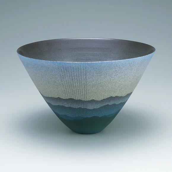 Bowl with mountain range design in colored slip.