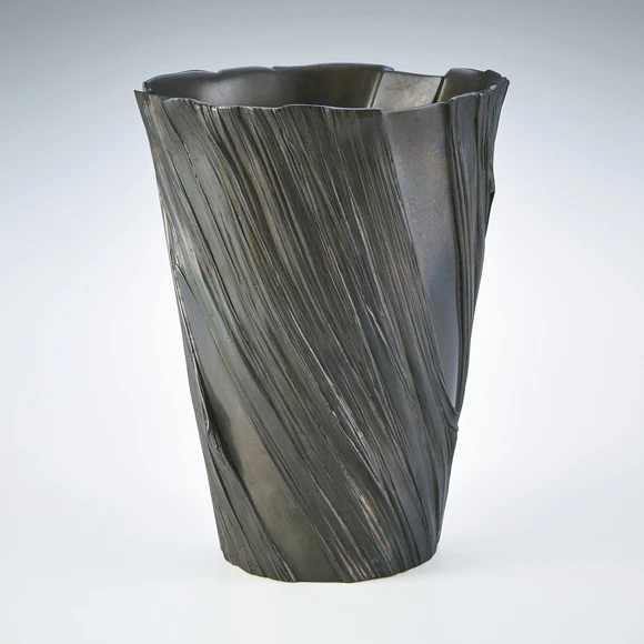 Flower vessel cast in cire perdue method.