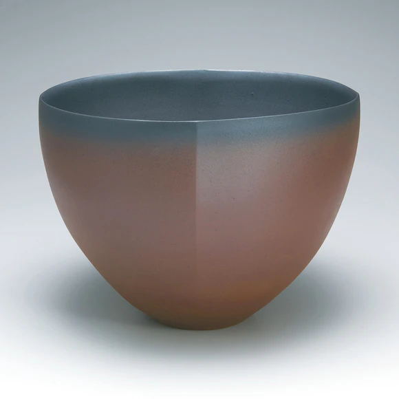 Flower vessel with red glaze.