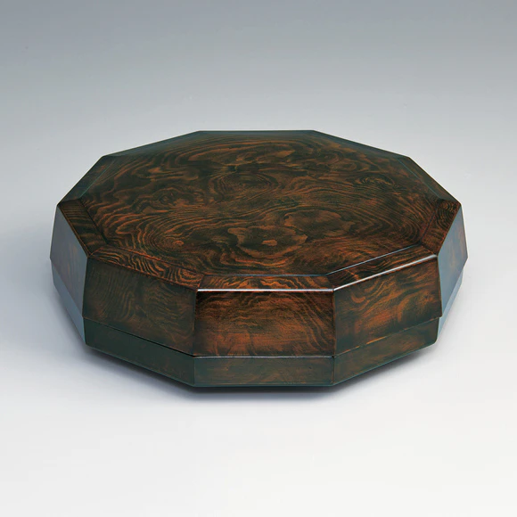 Decagonal box of pine wood finished in wiped urushi.