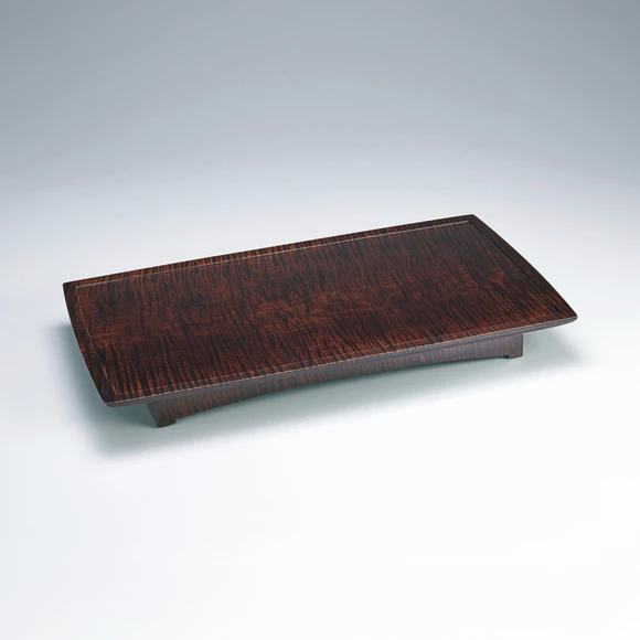 Low dug out table of horse chestnut wood finished in wiped urushi.