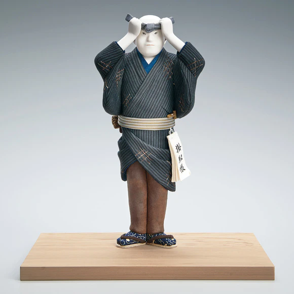 “New Year’s eve”. Formed with tōso over wooden core and dressed in kimekomi.