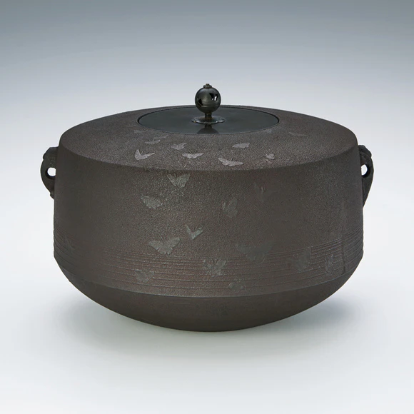 Tea ceremony kettle with design of butterflies. “Chōkai”