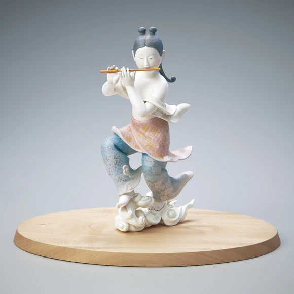 “Playing music on cloud”. Formed with tōso over wooden core covered with washi paper.