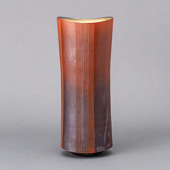 Red flower vessel with line design