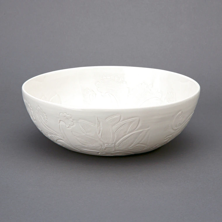 photo White Porcelain Bowl with Incised Flower Design