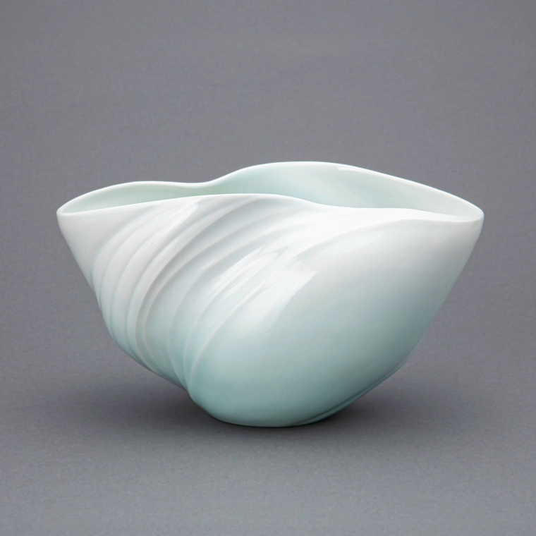 photo White Porcelain Flower Vessel with Pale Blue Glaze Flame "The Swell"