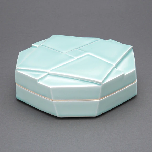 White Porcelain Covered Vessel with Pale Blue Glaze and Geometrical Design