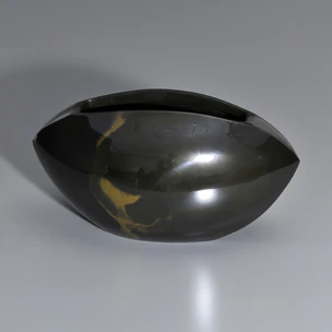 Flower vessel cast in two different metals.