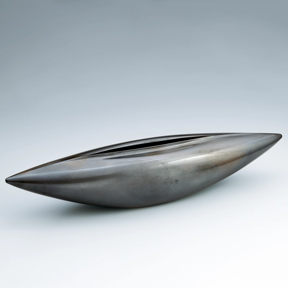 Flower vessel cast in two different metals.