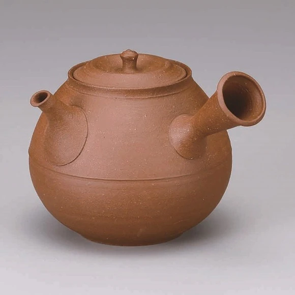 Teapot of dark brown clay