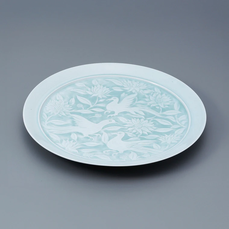 photo Large White Porcelain Dish with Pale Blue Glaze and Flower and Bird Design
