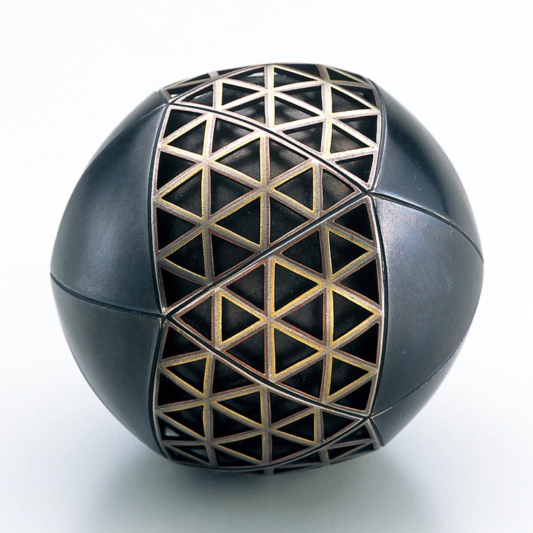 photo Openwork Iron and German Silver Musical Ball Made by Heat Welding Method with Design in Cutout Inlay