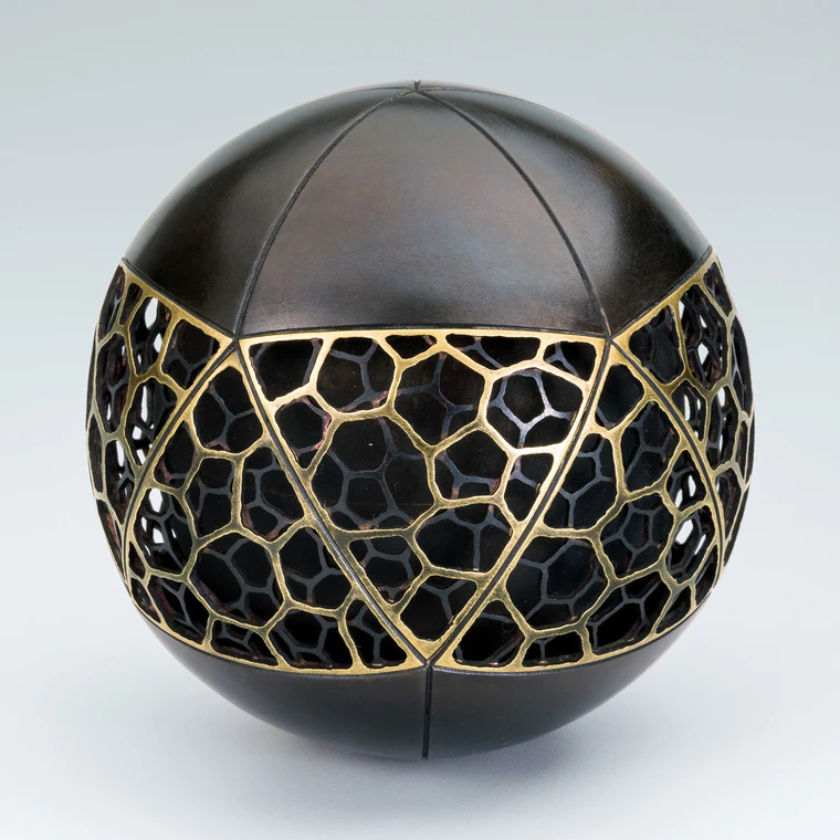 photo Openwork Copper and Brass Musical Ball