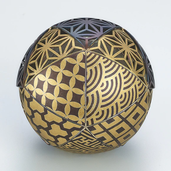 Openwork Musical Ball with Cutout Inlay