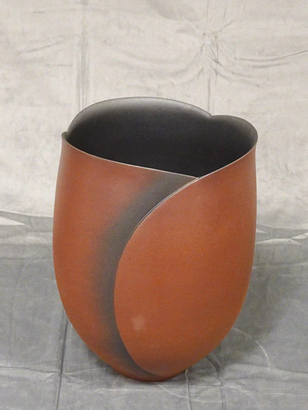 Flower vessel with iron black and red glaze.