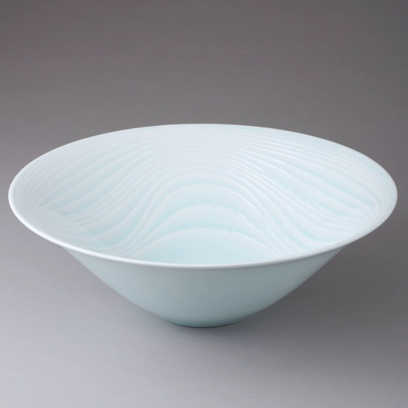 White Porcelain Bowl with Pale Blue Glaze and Curved Line Design in Sgraffito