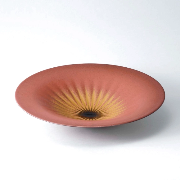 Bowl with iron glaze and ridged line design