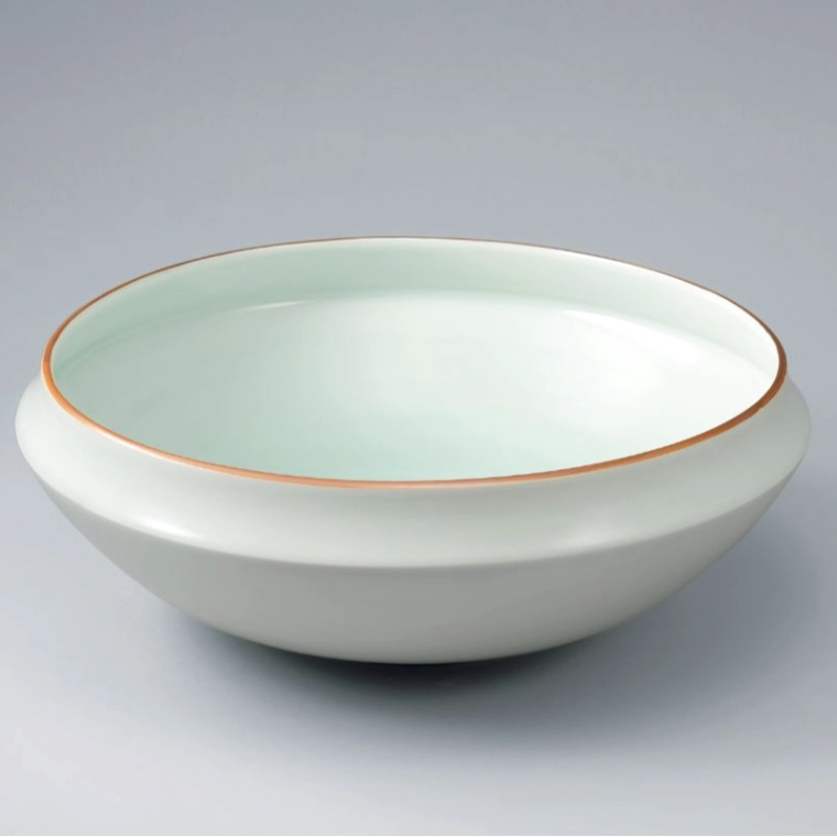 photo White Porcelain Bowl Pale Blue Glaze and Red Rim