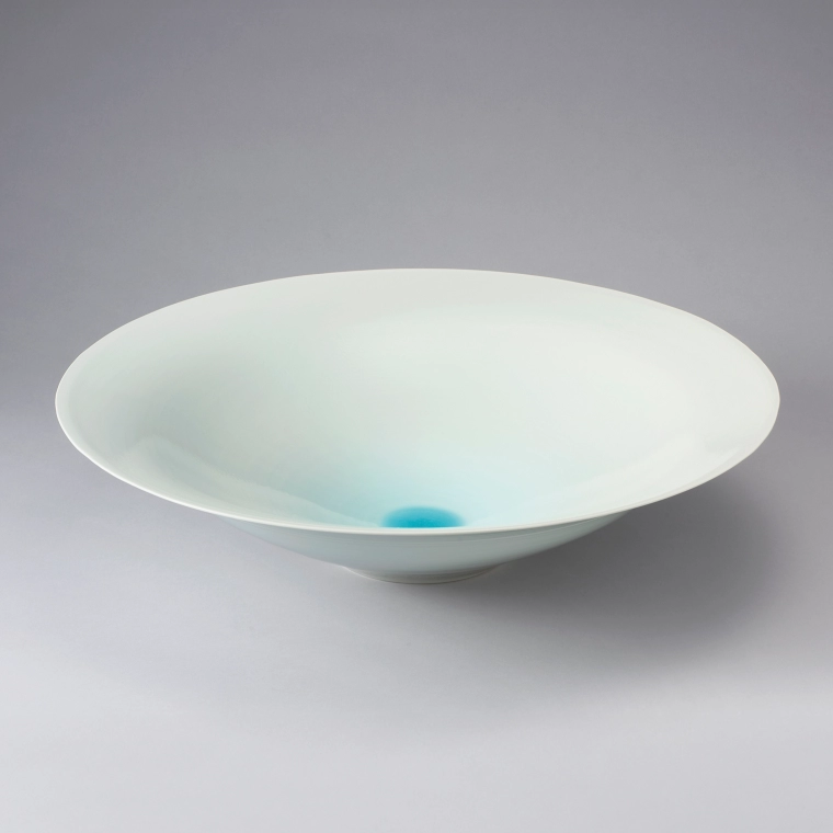 photo White Porcelain Bowl with Pale Blue Glaze