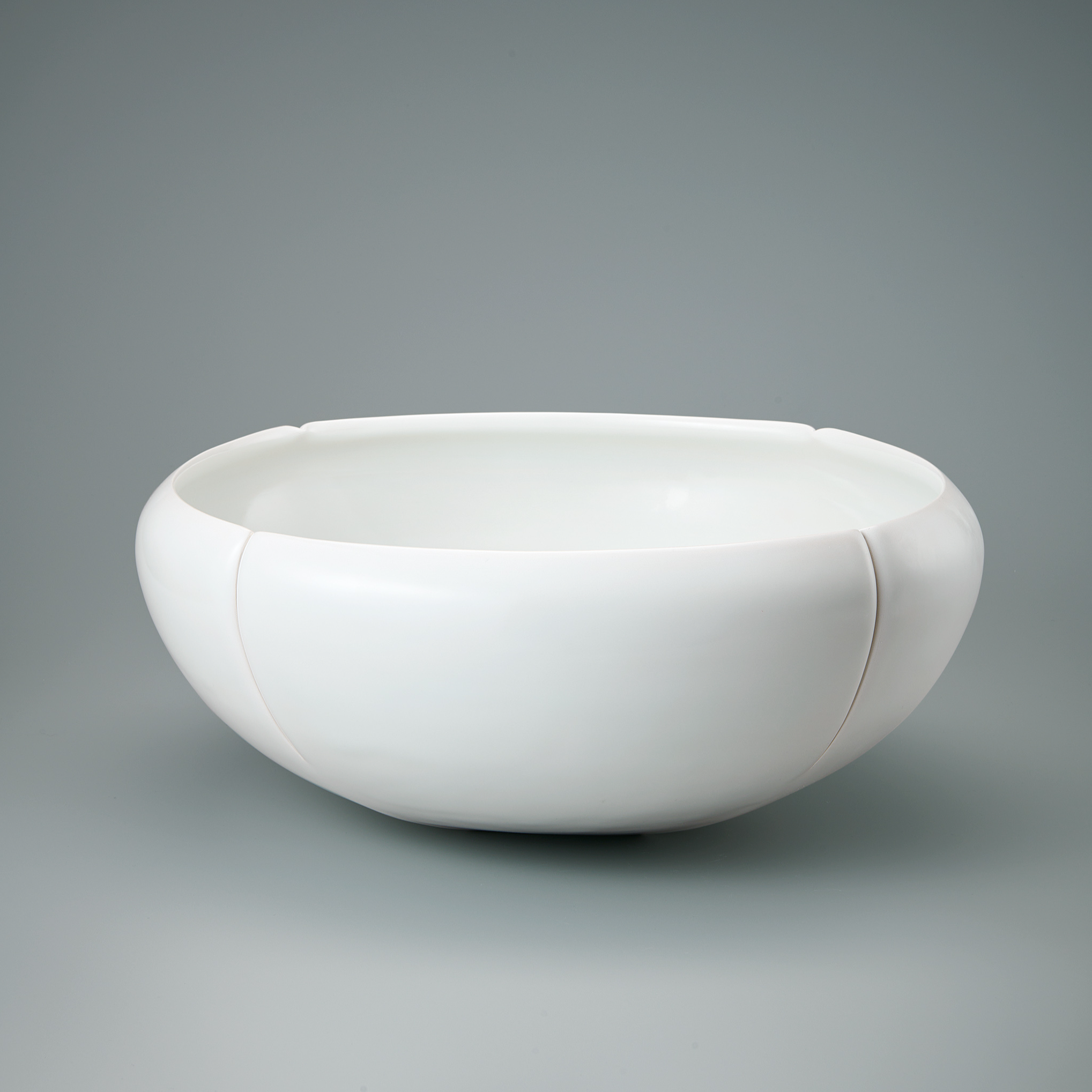 photo White porcelain four sided bowl.