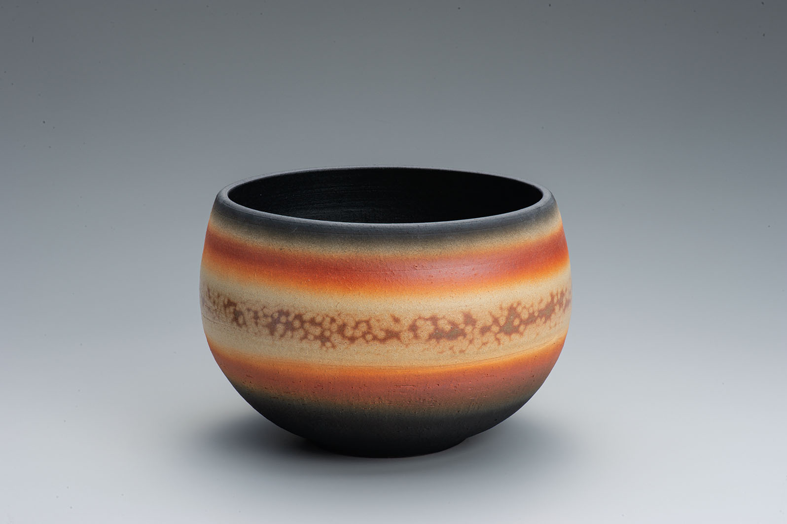 photo Flower vessel with glaze in kakewake style and kiln mutation effects.